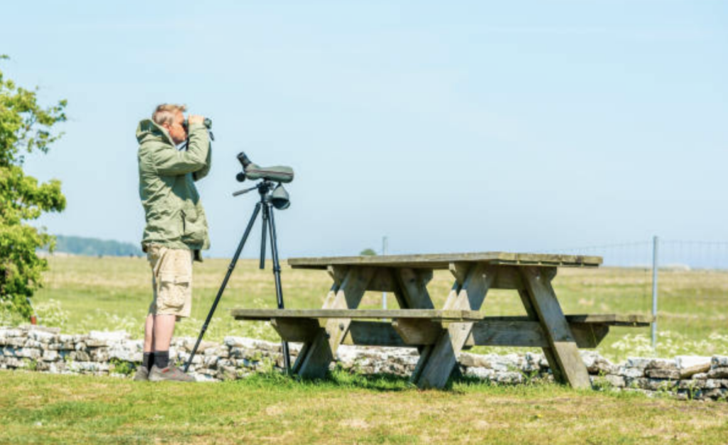 The Ultimate Guide to Binocular Tripods: Stability for Birdwatching, Stargazing, and More 2 man with binocular tripod
